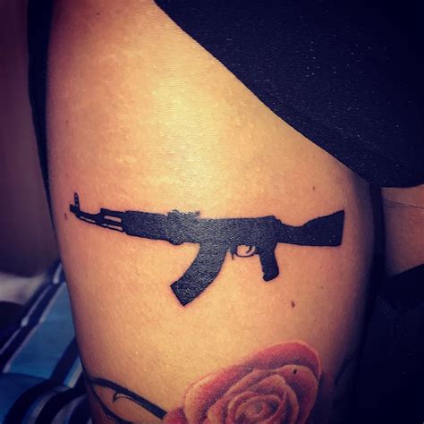 gun tattoo